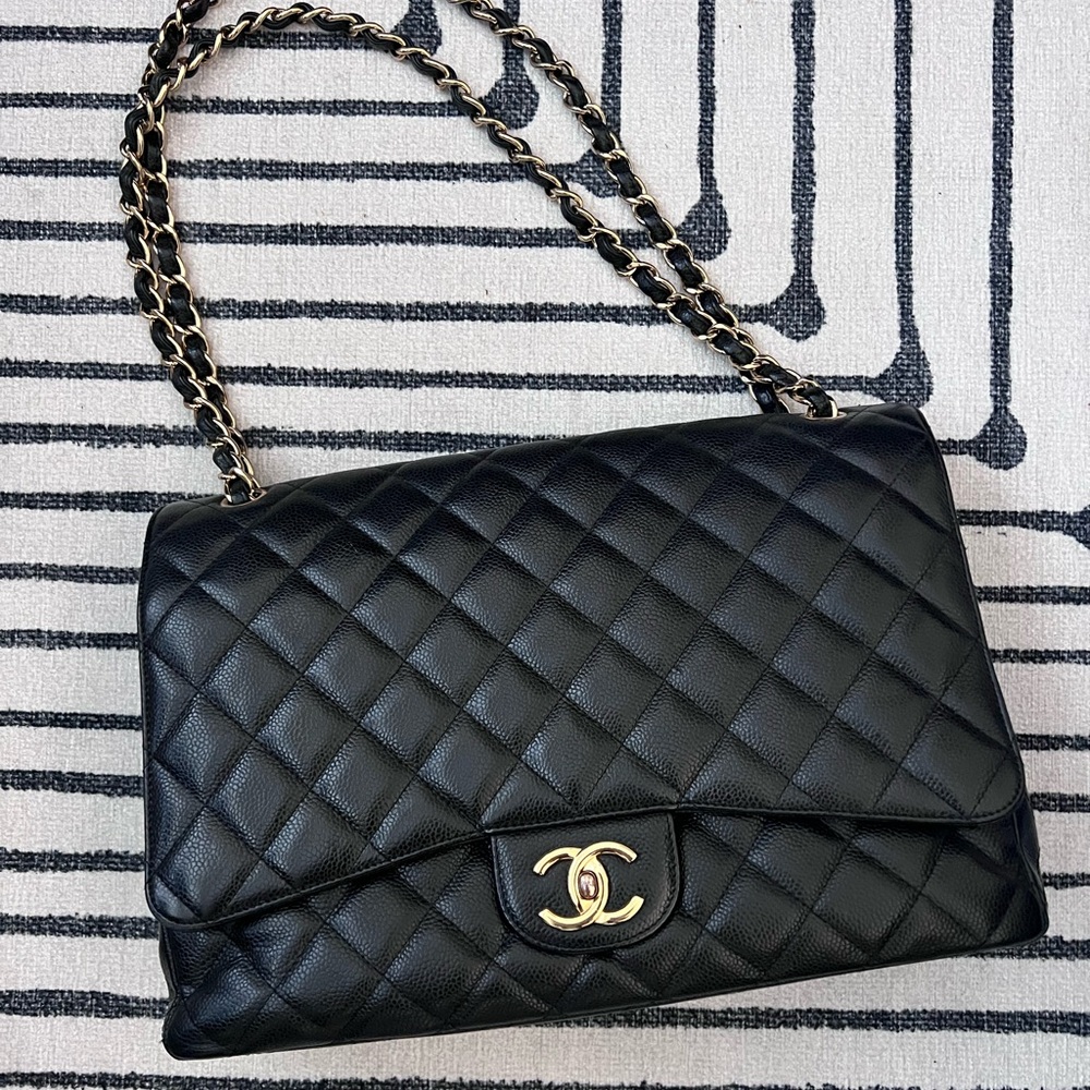 Chanel double flap maxi bag with caviar leather